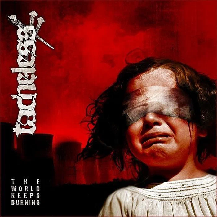 Tacheless – The World Keeps Burning